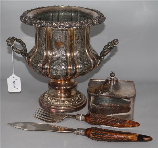A 19th century plated campana urn-shaped wine cooler, a plated tea caddy and a pair of fish servers with antler handles